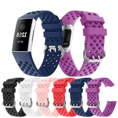 A collection of breathable silicone replacement watch bands for the Fitbit Charge 3 in many colors.