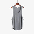 Showlu Fashion Men's cotton gym stringer tank top, sleeveless bodybuilding vest with a fitted design for men’s activewear.
