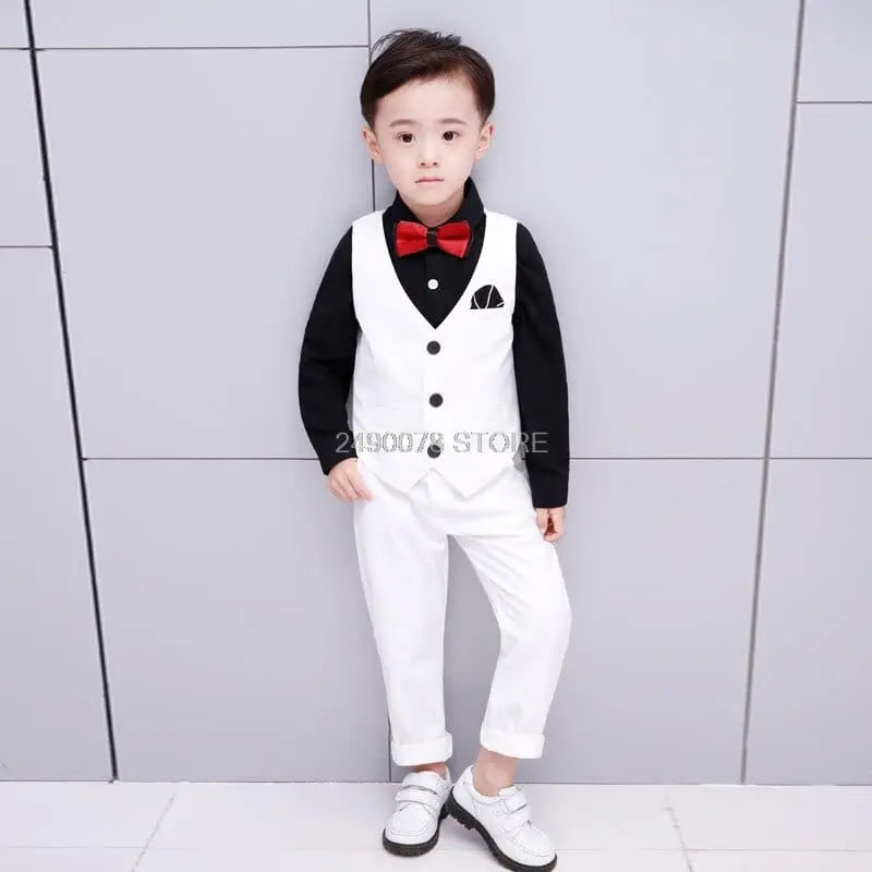 White boys' wedding suit with blazer and bowtie, formal tuxedo for kids, shown by Showlu Fashion Store.