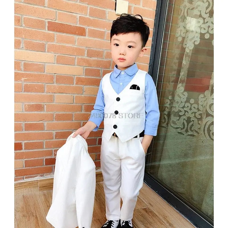 White boys' wedding suit with blazer and bowtie, formal tuxedo for kids, by Showlu Fashion Store, suitable for ceremonies and parties.