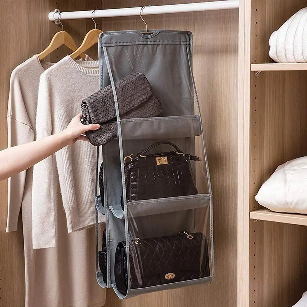 Transparent hanging handbag organizer by Anel Demosthene, with multiple compartments for closet storage and door hanging convenience.