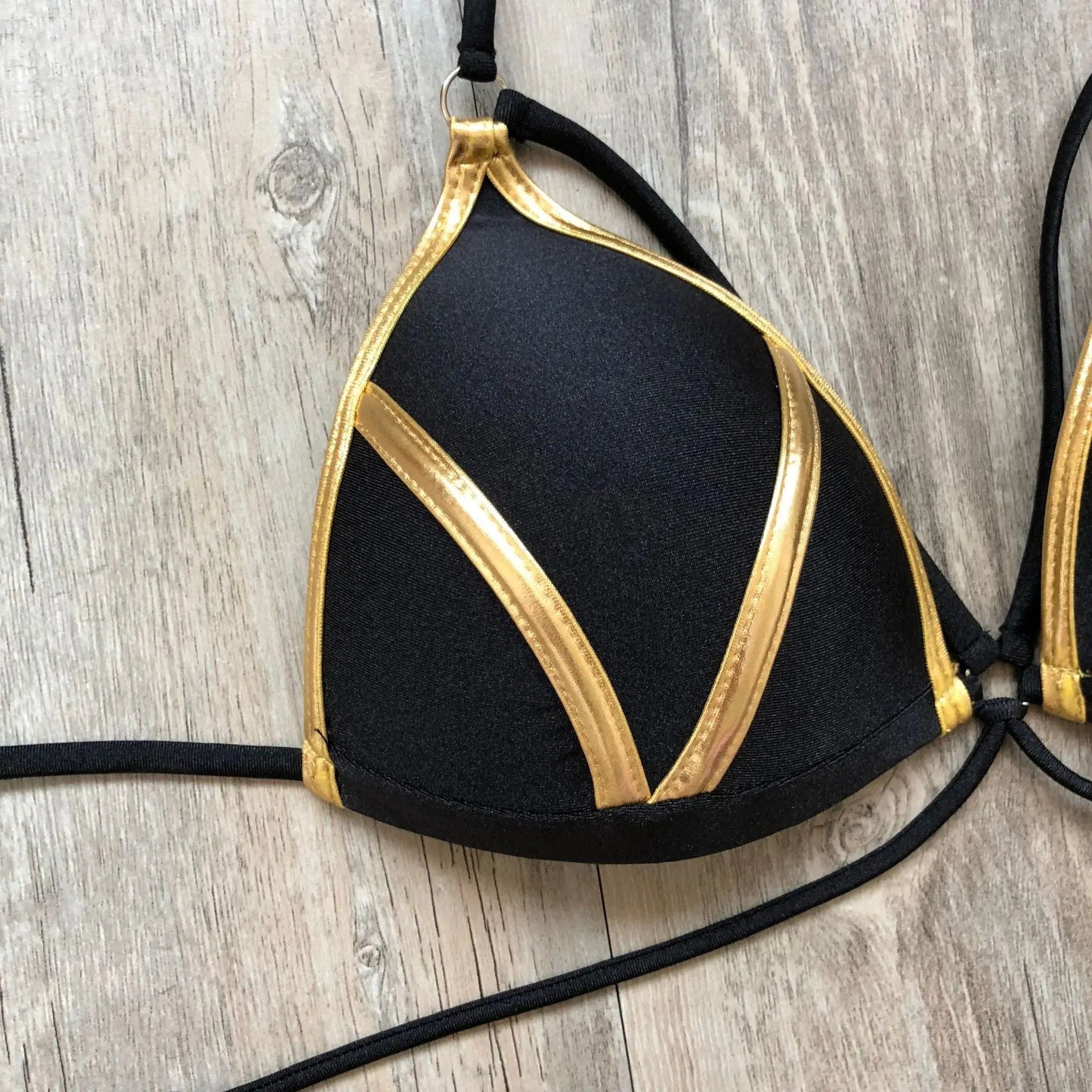 Gold stamping bikini set by Showlu Fashion Store featuring padded Brazilian swimwear with gold detail and adjustable straps.