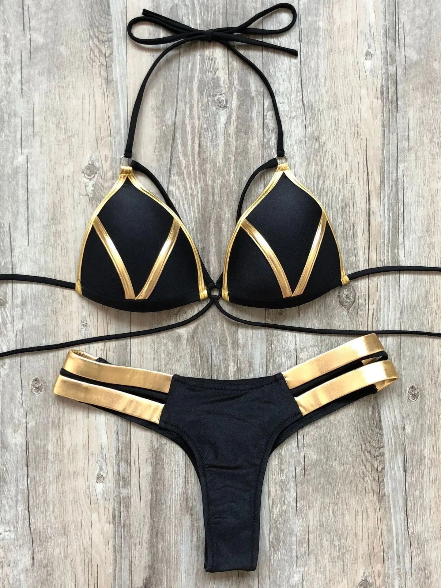Gold stamping bikini set by Showlu Fashion, padded Brazilian swimwear with stylish gold accents, displayed on a model.