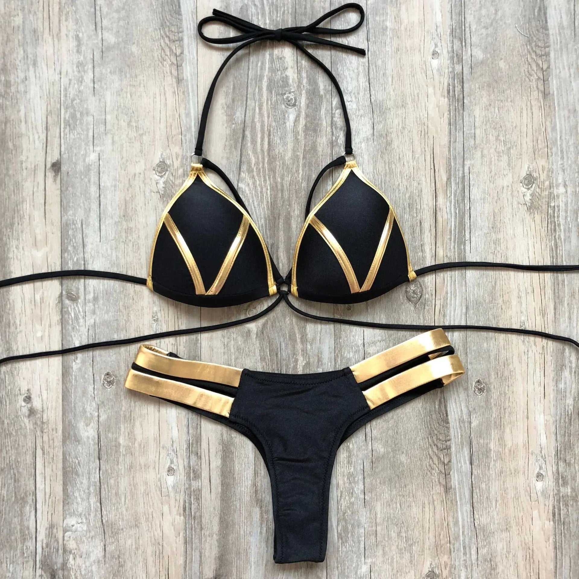 Gold stamping bikini set from Showlu Fashion featuring padded Brazilian swimwear, with a stylish gold-embossed design.