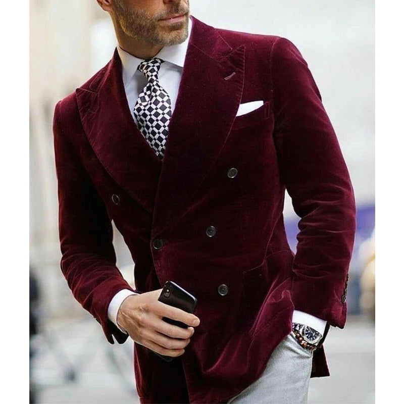 Burgundy velvet men's blazer with double-breasted design, elegant smoking suit coat for formal occasions, shown in a stylish image.