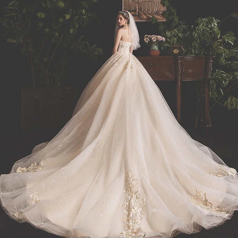 Off-shoulder Aster Garden lace wedding dress with high-low hem from Showlu Fashion Store, featuring intricate lace details and elegant design.