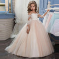 White flower girl dress by Showlu Fashion with lace applique and beaded details, perfect for first communion or special occasions.