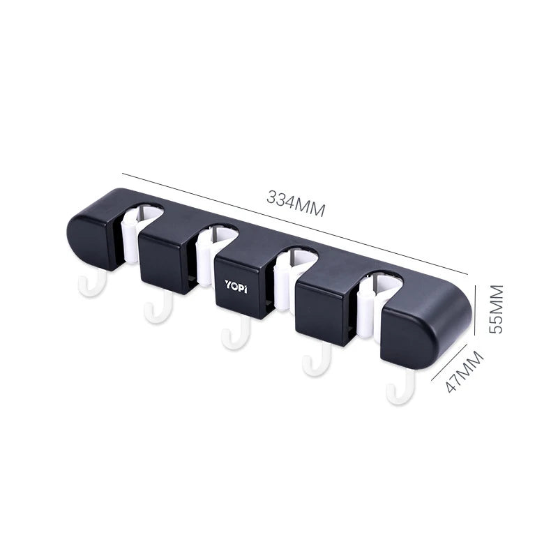 Wall mounted broom holder from Showlu Smart General, showcasing its sturdy design and multiple clips for organizing brooms and cleaning tools.