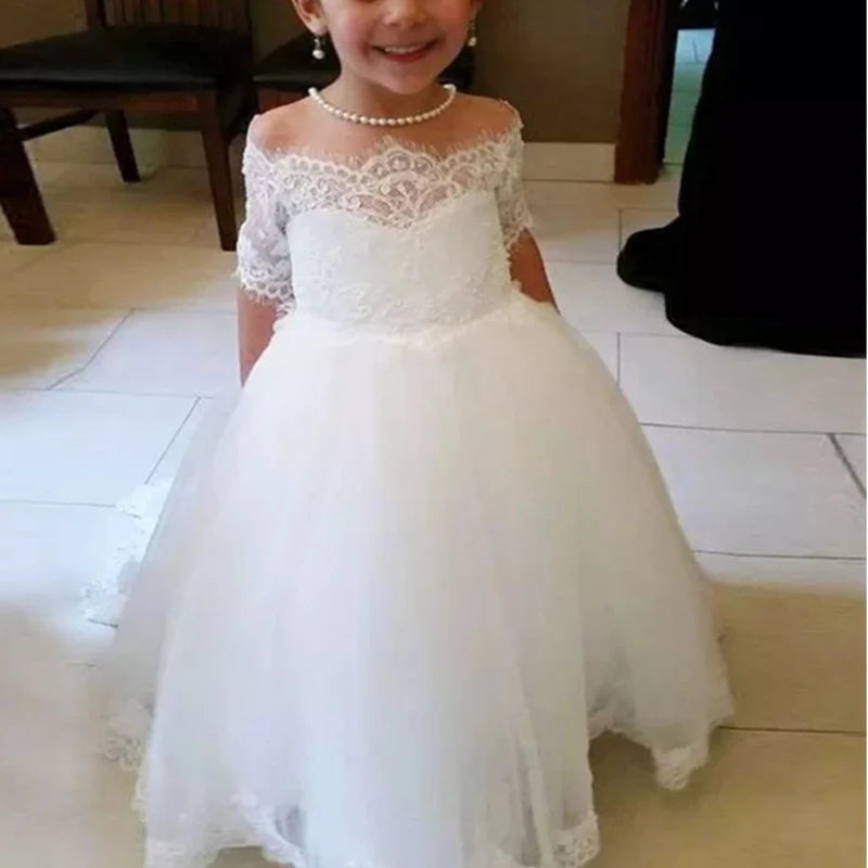White flower girl dress by Gdybao with lace appliqué and beaded details, perfect for first communion or special occasions.