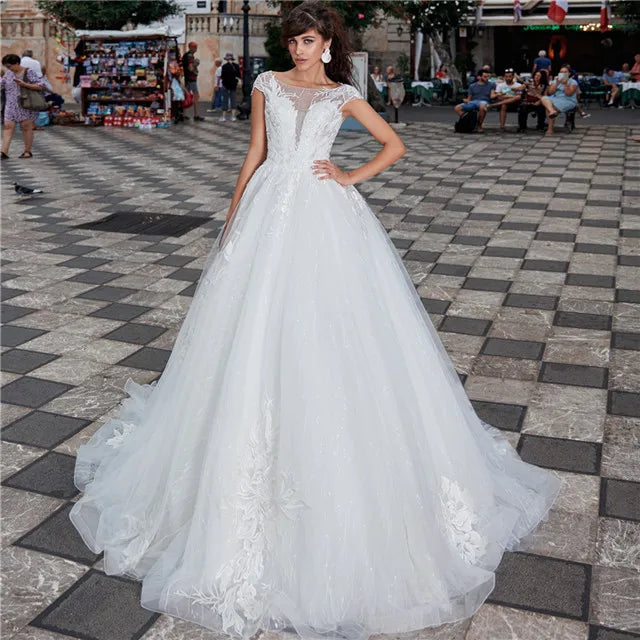 Lace Cinderella ball gown wedding dress with sweetheart neckline and full skirt, designed by Showlu Fashion Store.