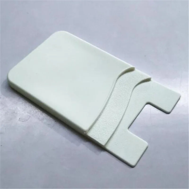 Showlu Smart General stick-on phone wallet attached to a smartphone, featuring card slots for convenient storage.