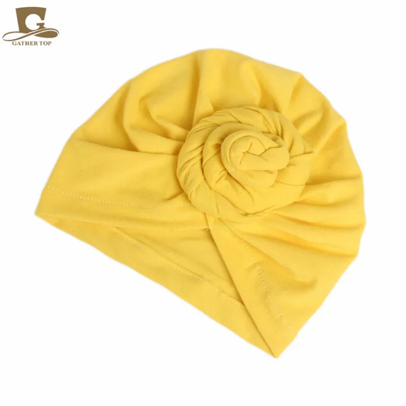 Cotton women’s knotted turban hat with hijab style, headband, and chemo cap design, suitable for Muslim head covering and night wear.