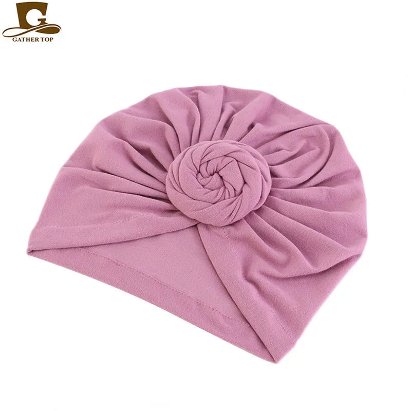 Women’s cotton turban hat with knot, hijab style head covering, night cap, and hair accessory in black fabric.