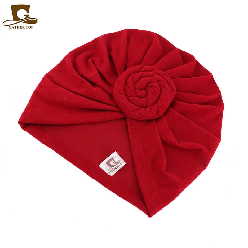 Women’s cotton turban hat with knot design, hijab and chemo cap style, showing head covering and hair accessory details.