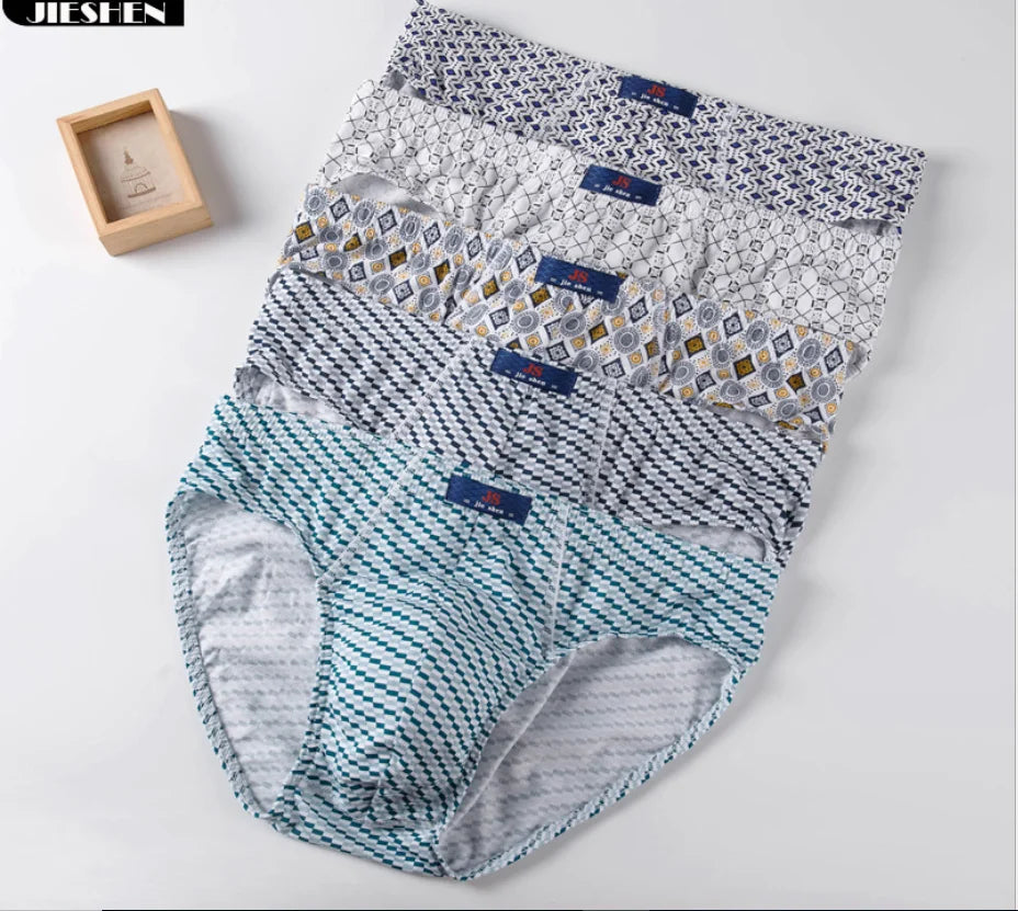 Set of five Showlu men's 100% cotton briefs featuring solid knit fabric, comfortable underwear with a snug fit.
