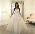White V-neck lace wedding dress by Showlu Fashion Store, sleeveless tulle bridal gown with elegant lace details.
