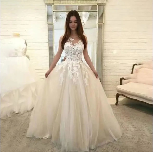 White V-neck lace wedding dress by Showlu Fashion Store, sleeveless tulle bridal gown with elegant lace details.