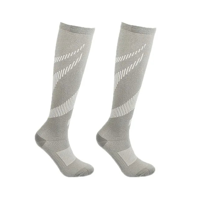 Black compression socks for men and women by Showlu Fashion Store, designed for football, sports, and pain relief with 20-30 Mmhg compression.