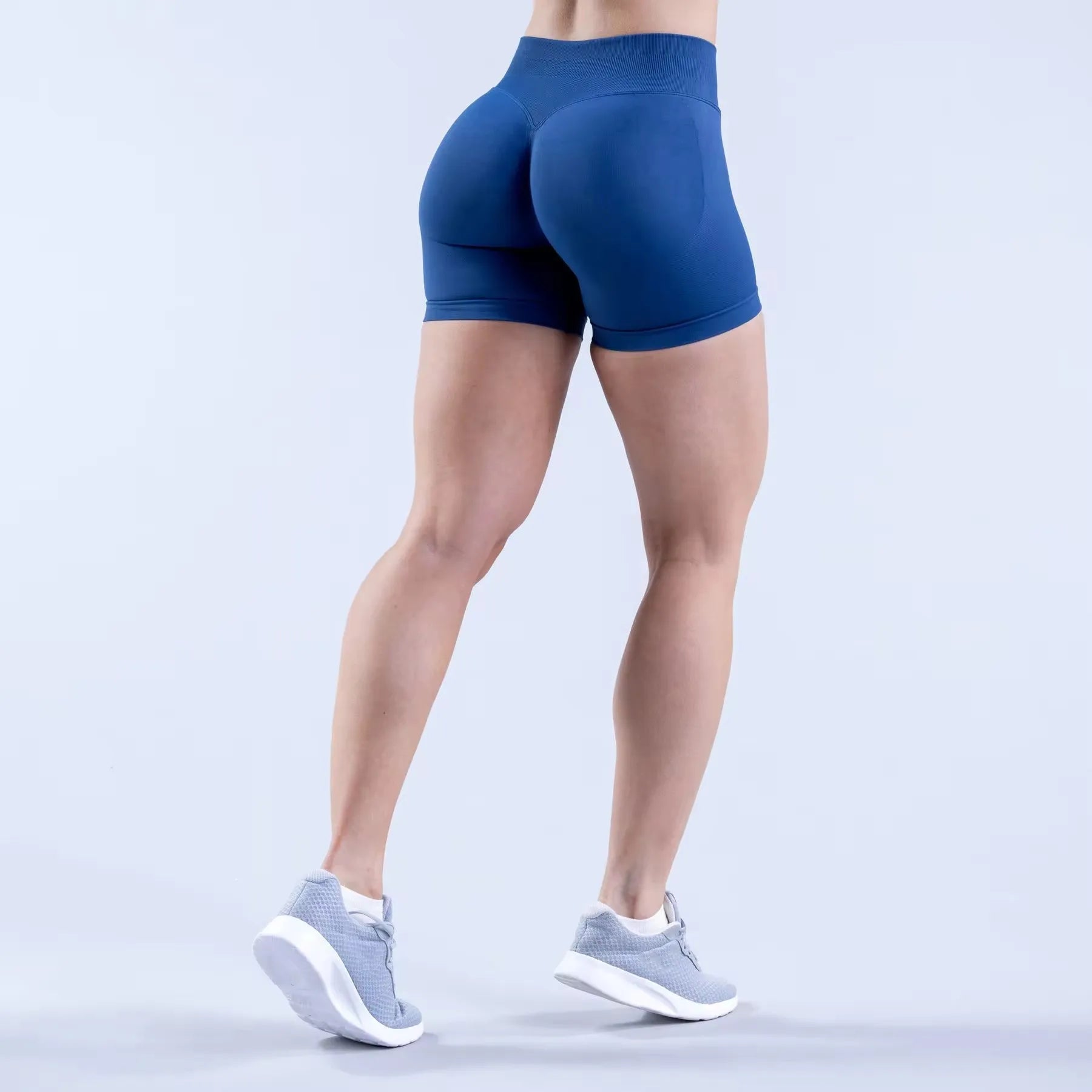 Women's high waist scrunch butt compression running shorts by Showlu Fashion, breathable seamless skinny fit, available in small and XL.