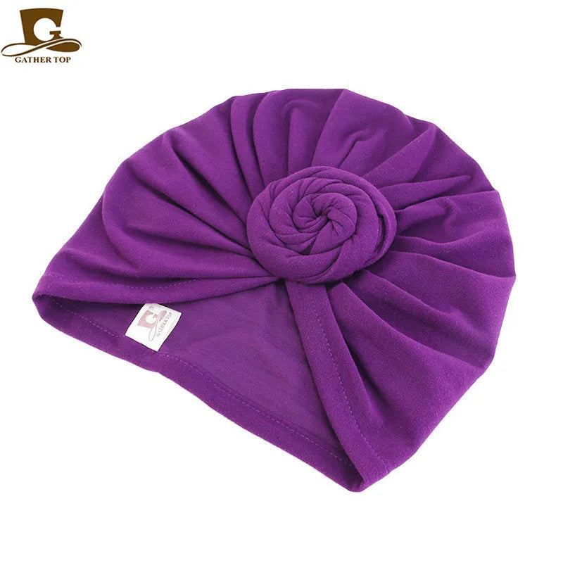 Women’s cotton turban hat with knotted design, hijab style head covering, ideal as a chemo cap or night hair accessory.