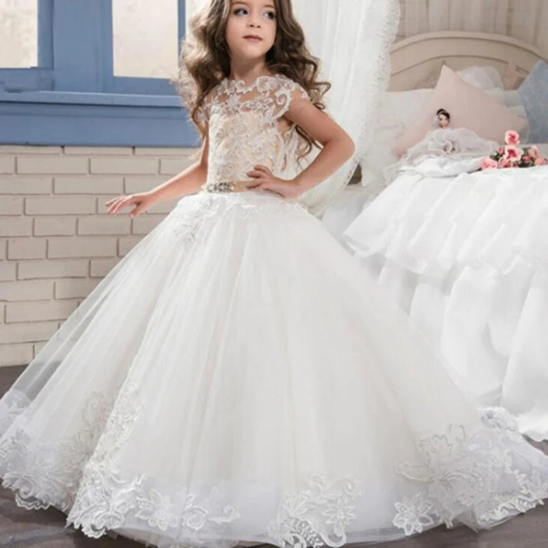 White flower girl dress by Showlu Fashion with lace applique and beaded details, perfect for first communion and special occasions.