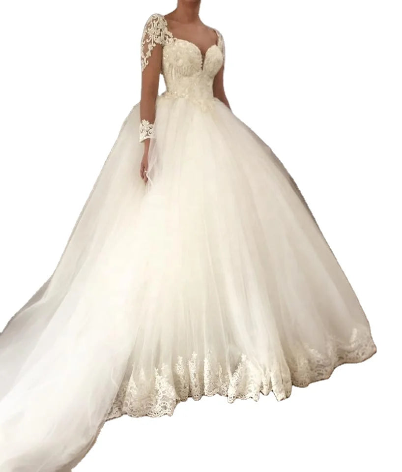 Aster Garden long sleeve lace ball gown wedding dress in luxurious white with intricate lace details and elegant silhouette.