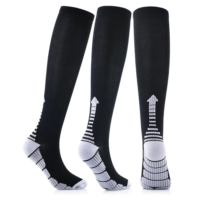 Black compression socks for men and women, designed for running and football, with anti-fatigue and pain relief features.