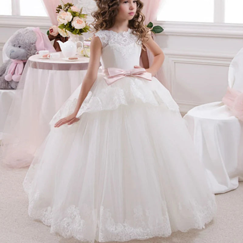 White flower girl dress by Showlu Fashion with lace applique and beaded details, perfect for first communion and special occasions.