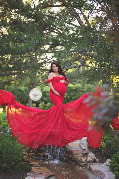 Pregnant woman in off-shoulder cotton and chiffon maternity gown, ideal for maternity photography and pregnancy photo shoots.