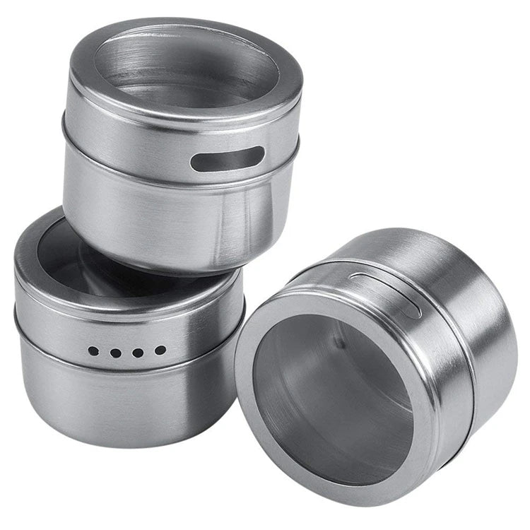 Set of magnetic stainless steel spice jars from Showlu Smart General, shown attached to a kitchen magnetic strip for easy access.