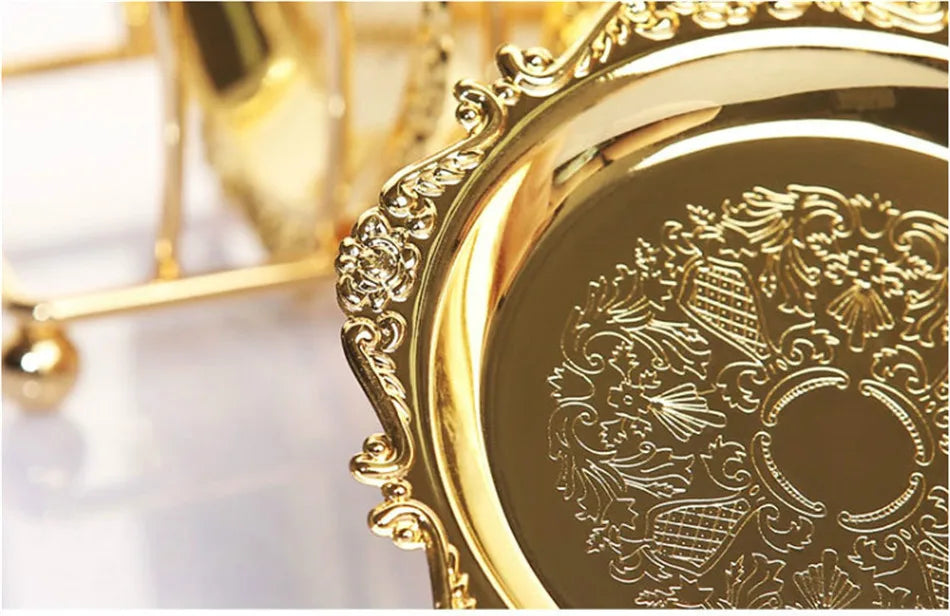 Six classical golden metal cocktail coasters with vintage zinc alloy finish, silver and gold plated, displayed on a wooden surface