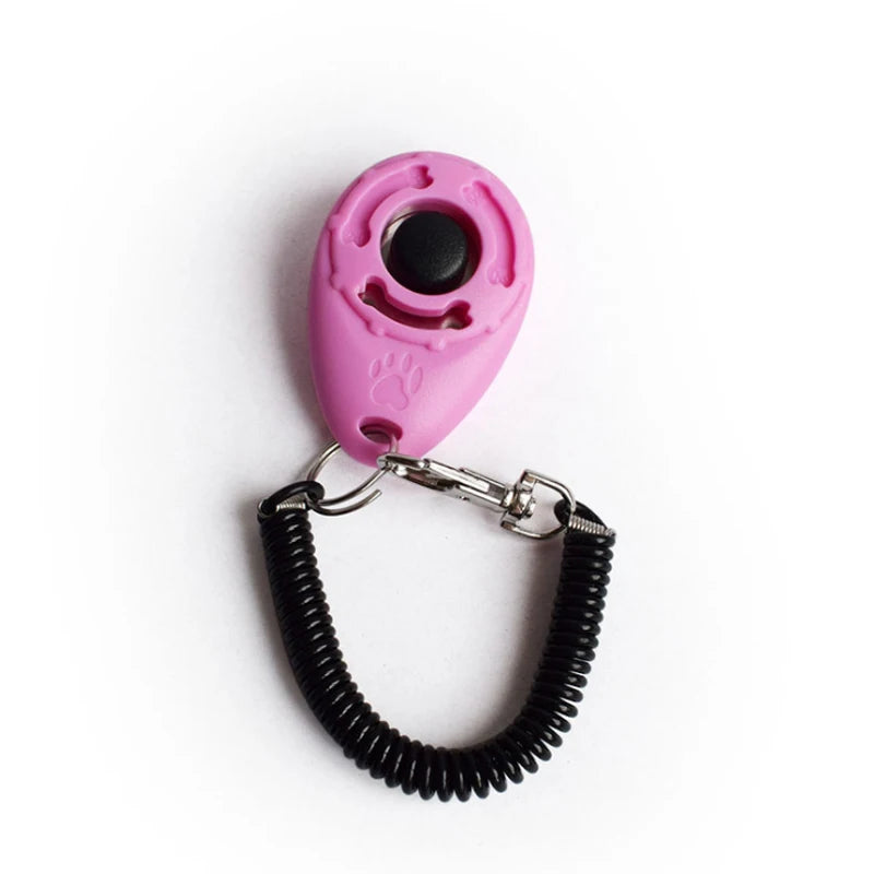 Showlu Smart General pet training clicker with a compact plastic design, used for positive reinforcement during training sessions.