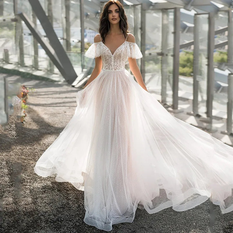 White V-neck lace wedding dress by Showlu Fashion, sleeveless tulle bridal gown with intricate lace details and elegant fit.