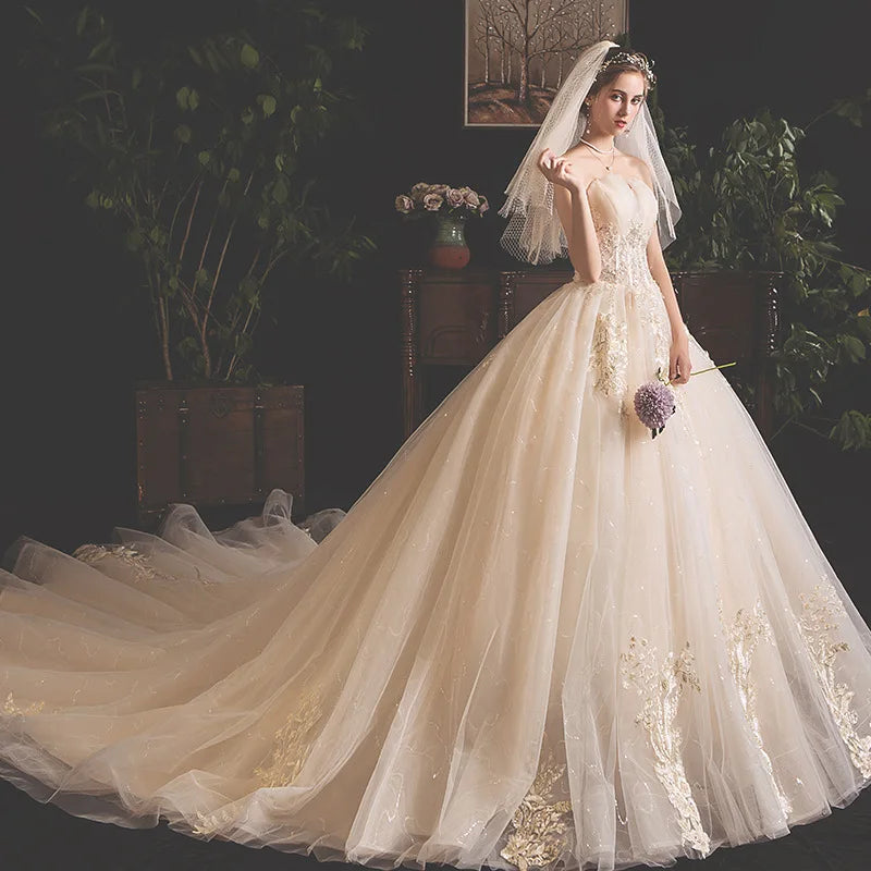Aster Garden Lace Wedding Dress by Showlu Fashion, off-shoulder high-low bridal gown with intricate lace details and flowing skirt.