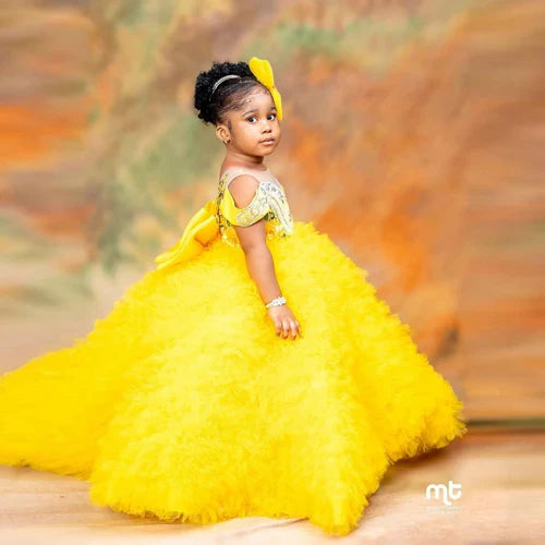 Showlu yellow tiered tulle flower girl dress with big bow, perfect for parties and special occasions.