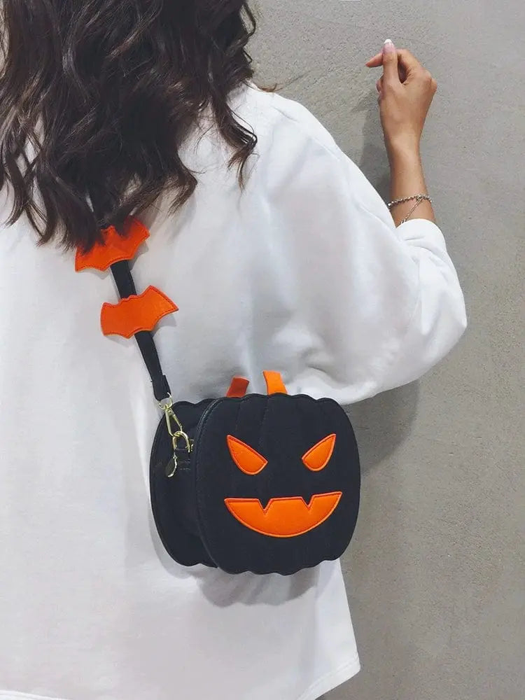 Linglan Halloween Pumpkin shoulder bag by Showlu Fashion Store, a fun PU leather crossbody pouch with festive pumpkin design for women.