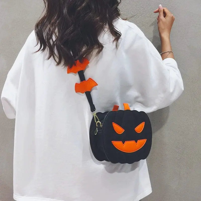 Linglan Halloween pumpkin shoulder bag by Showlu Fashion Store, made of PU leather, featuring a fun Halloween pumpkin design and crossbody style.
