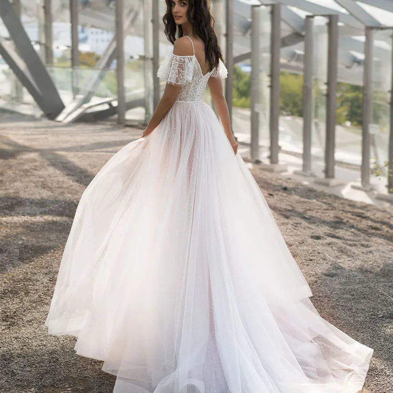 White V-neck lace wedding dress by Showlu Fashion with sleeveless tulle design, perfect for bridal occasions.