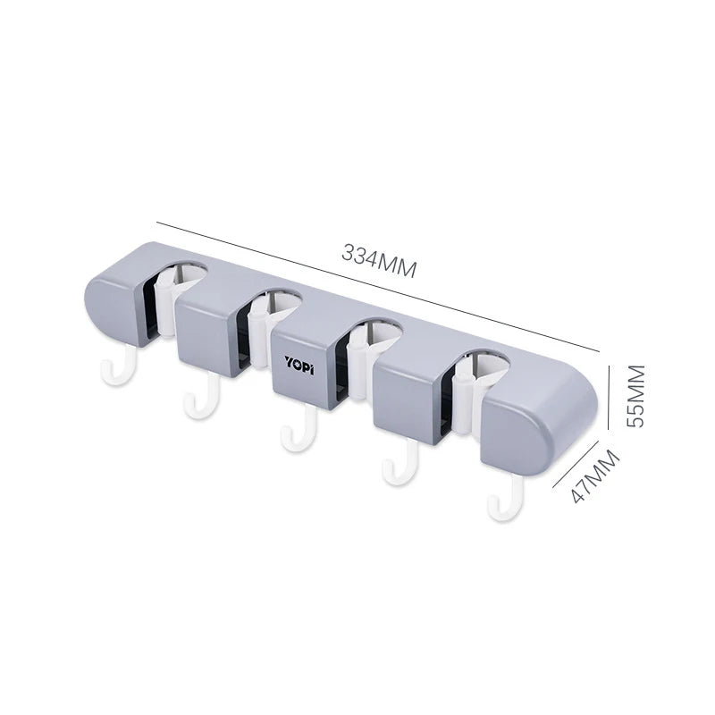 Wall mounted broom holder from Showlu Smart General, showing its durable design and multiple slots for organizing brooms and tools.