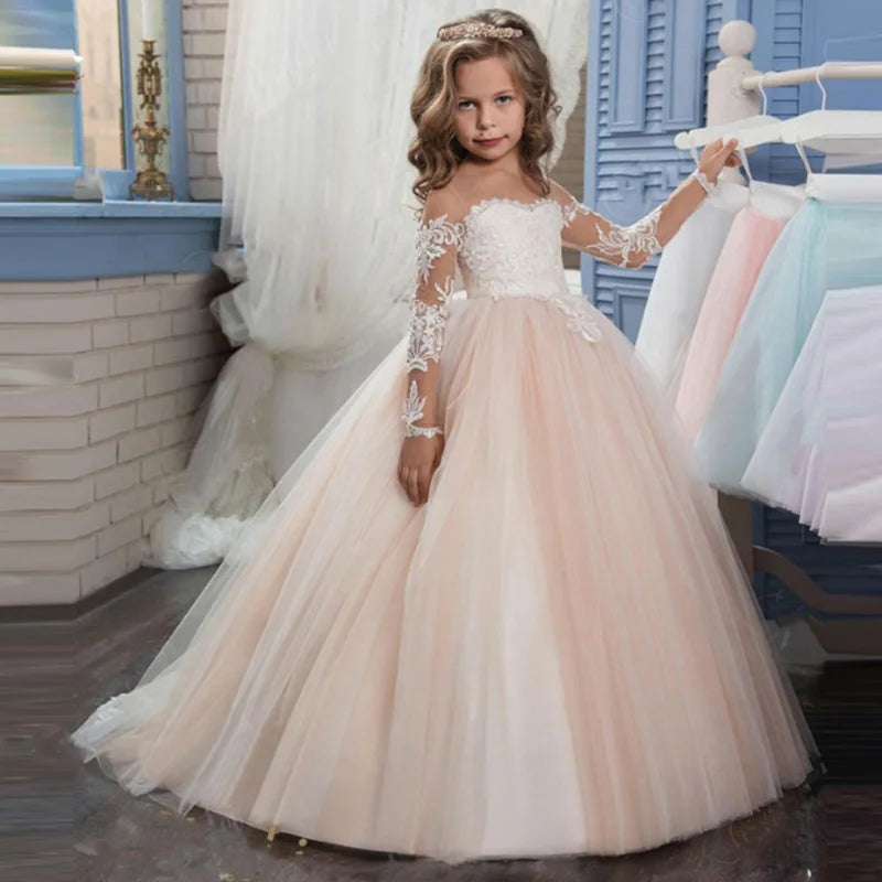 White flower girl dress by Showlu Fashion with lace applique and beaded details, perfect for first communion and special occasions.