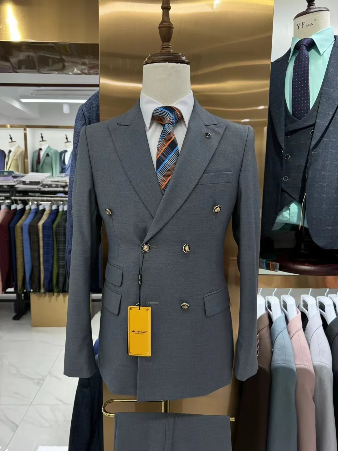 Men's double-breasted slim fit business suit by SHOWLU FASHION STORE, made of cotton, shown in a professional style.