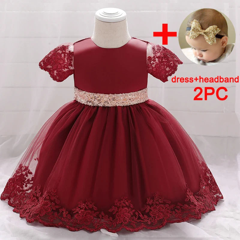 Baby girl princess dress with sequined bow, suitable for baptism or birthday, featuring a soft, elegant gown for newborns.