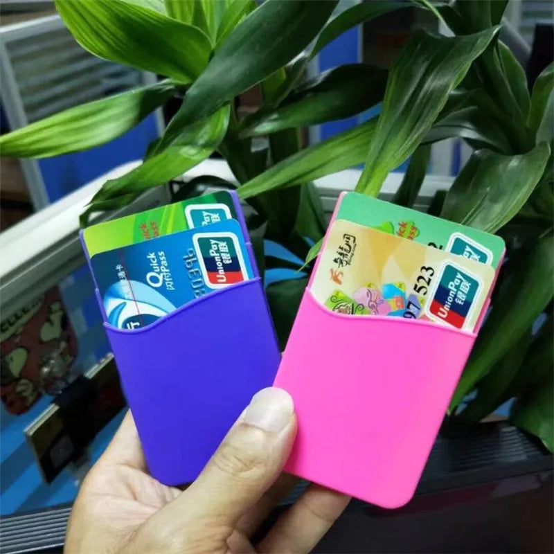 Showlu Smart General stick-on phone wallet attached to a smartphone, featuring card slots and a sleek, portable design.