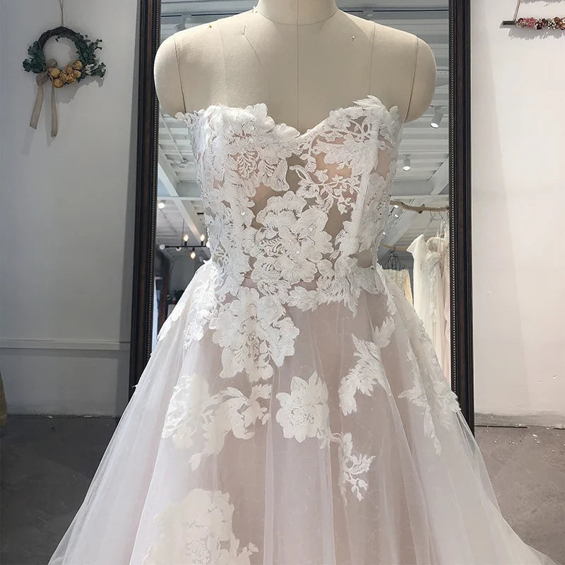 Showlu Fashion strapless lace bridal gown with appliqué tulle, A-line silhouette, sweetheart neckline, and court train for wedding.