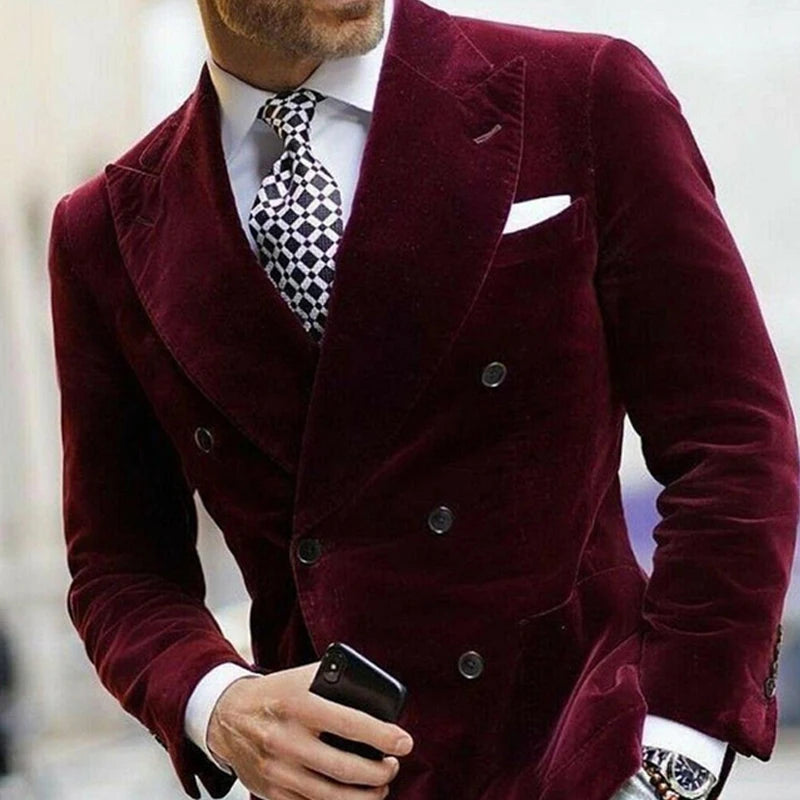 Burgundy velvet men's blazer with double-breasted design, elegant dinner jacket style, suitable for formal or smoking occasions.