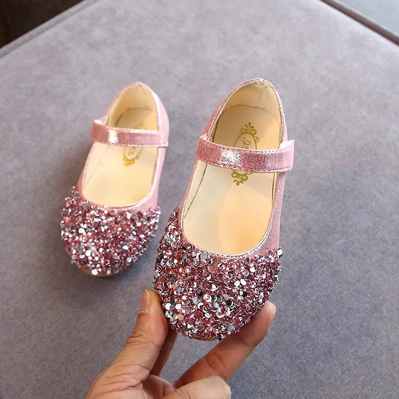KushyShoo girls glitter princess toddler flat dance sandals with colorful glitter, open toes, and ankle straps, ideal for special occasions.