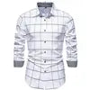 Men's plaid long sleeve casual shirt by Showlu Fashion, featuring a cotton blend material and classic design.