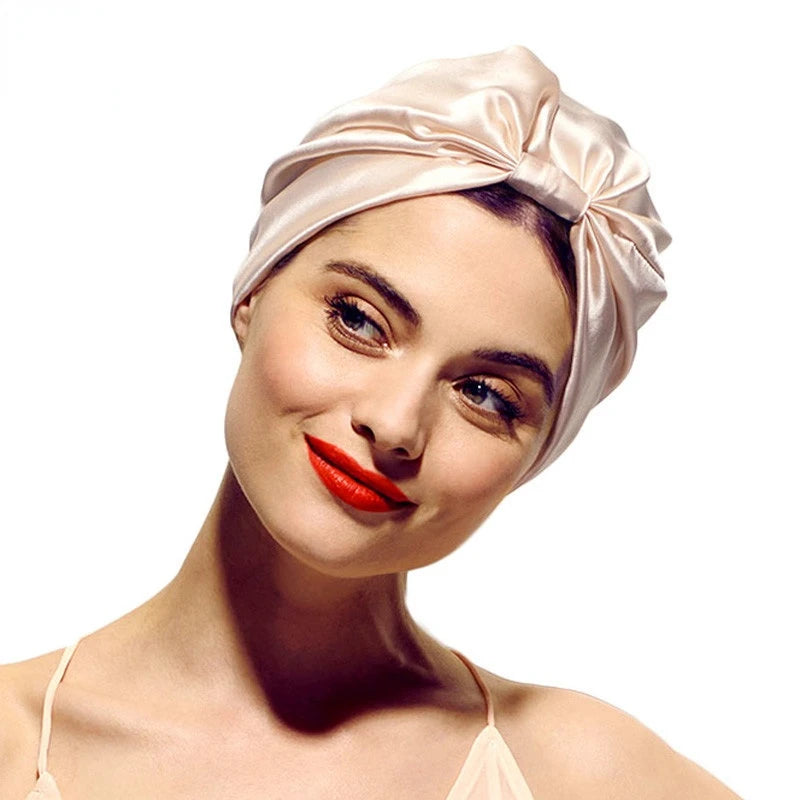 Silky satin sleep bonnet cap for women with double layer design and knotted headband, ideal for nursing or chemo head covering.