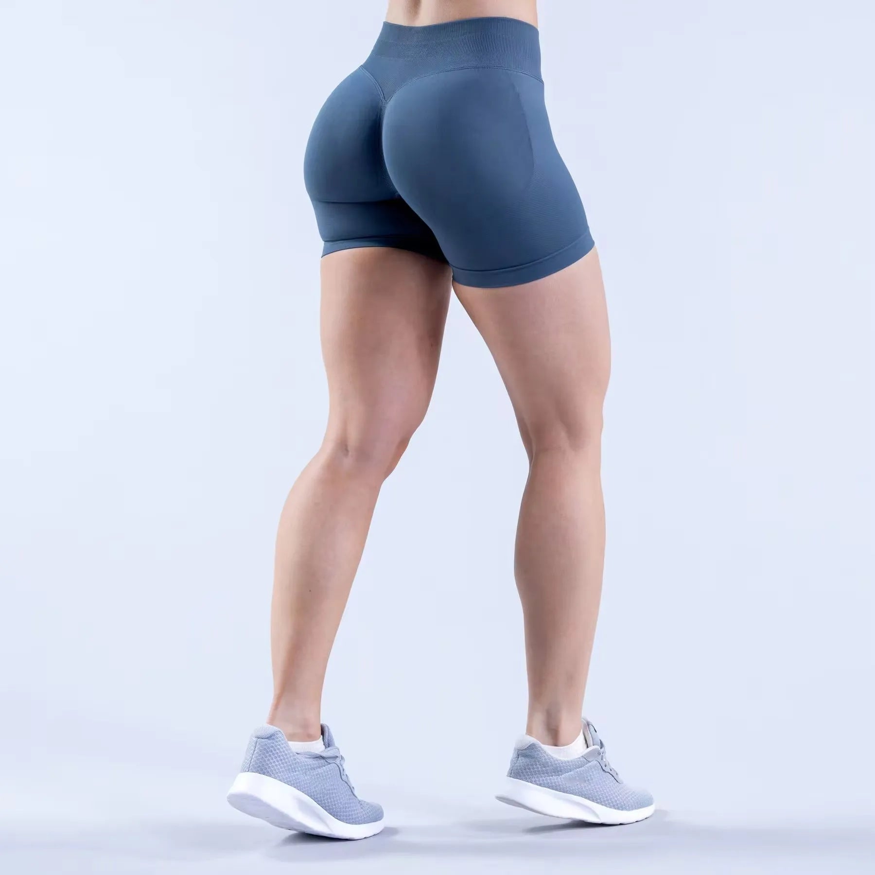 Women's high waist scrunch butt compression running shorts by Showlu Fashion, breathable seamless skinny fit, available in small and XL sizes.