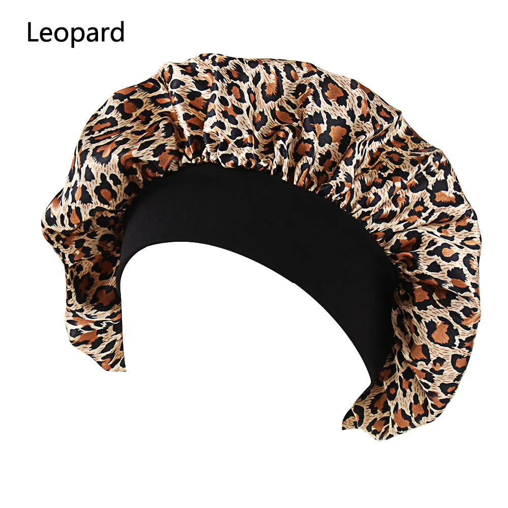 Elegant satin bonnet for women with wide elastic band, designed for sleep, hair protection, and hair loss cover.